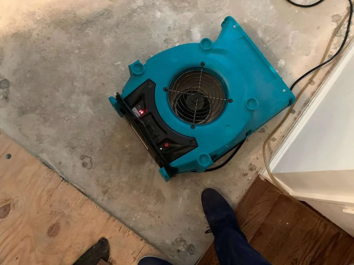 Air mover drying subfloor during Leak Detection & Repair in Lake Lorraine